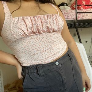 Pink dotted ruffuled tank top